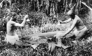 Hawaiian men pounding poi, c. 1890