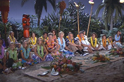 The Brady Bunch at a luau with their flower lei