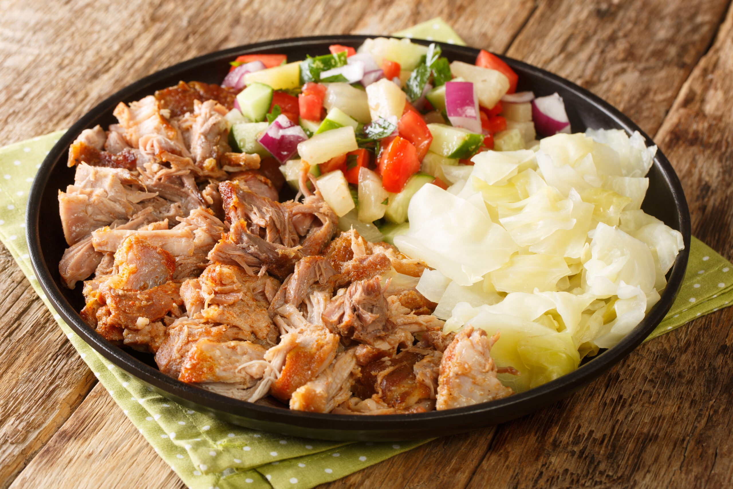 Plate of Kalua pork and vegetables