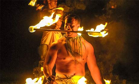 Fire-knife dancers perform at Toa luau. 