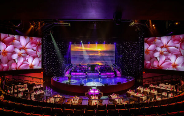 The lights are dimmed and the tables are set at the Rock-a-Hula Luau inside the Royal Hawaiian Theater.