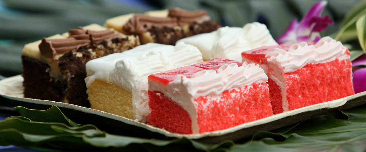 Luau desserts, a tray with three types of cake.