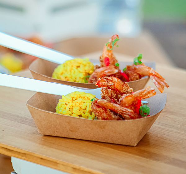 Fried coconut shrimp and seasoned rice are part of the luau feast.