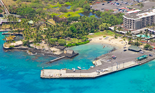 Aerial view of the this BIg Island Luau location, Kamakahonu Beach and the nearby historical landmarks.