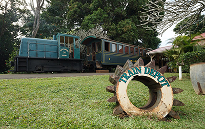 A train engine and passenger car at former sugar plantation. 