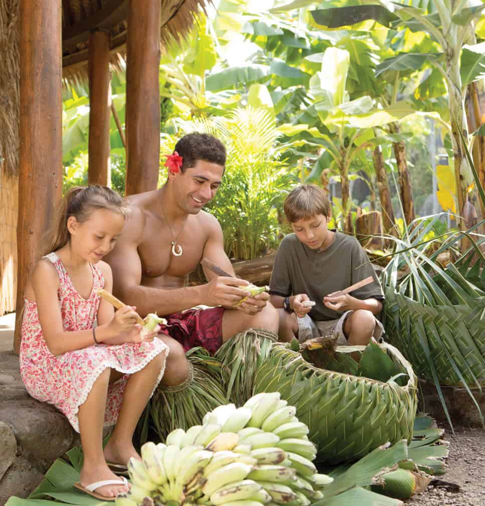 Children learn to weave a basket at the Polynesian Cultural Center.
